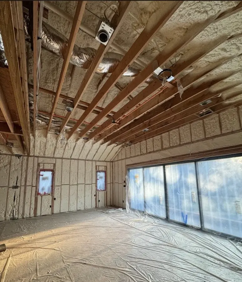 Interior walls and ceiling insulated with spray foam during new construction in Monmouth